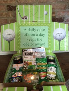 a golf themed gift box filled with goodies for someone's birthday or father's day