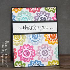 a thank you card with colorful flowers and the words, thank you written on it