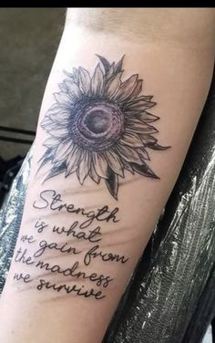 a woman's arm with a sunflower on it and the words strength is what you