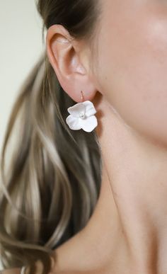 Each petal is hand-crafted out of white clay and held together by a real 14K gold-filled wire and a dazzling quartz bead. The real gold-filled hooks are hypoallergenic. The perfect floral addition to your bridal look. Please support my brand new shop :) I'm a tiny, Canadian business owner and make each pair of earrings with plenty of love. White Flower Earrings, Polymer Flowers, White Flower Earring, Gold Hooks, Real Flower Jewelry, Bridal Look, Wedding Jewelry Earrings, White Clay, Floral Earrings