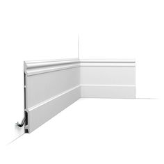 the corner of a white wall with an electrical outlet