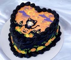 there is a cake decorated with an image of a cat and pumpkins on it