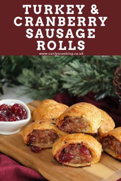 turkey and cranberry sausage rolls on a cutting board