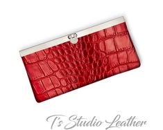 "Red Alligator Crocodile Embossed Texture Cowhide Leather Western Style Women's Wallet This bi-fold women's wallet is made with genuine cowhide leather in a gorgeous deep red croc embossed texture. The interior has two open compartments for bills, and several card slots. Finished with a decorative brass frame with push lock closure. Wallet is available in other leather colors and textures. Dont forget to check out the matching phone case and handbag! Measurements: CLOSED - 7.5\" x 3.75\" OPEN - Matching Phone Cases, Alligator Crocodile, Croc Leather, Wallets For Women Leather, Money Clip Wallet, Leather Tassel, Western Style, Leather Jewelry, Deep Red