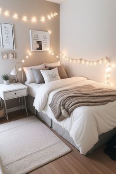 a bedroom with lights on the wall and a bed in front of a white rug