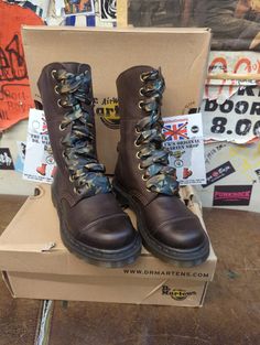 These 9 hole Dr Martens boots are a style that's no longer in production. They were part of the Triumph range, just a lower version. The boot is finished in a nice brown waxy leather. It has a stitched toe cap and camo laces matching it's interior. The boot can be folded to show it off . These are a UK size 3, European 36,ladies USA 5 Brown Lace-up Combat Boots With Rubber Sole, Brown Steel Toe Martin Boots For Outdoor, Outdoor Brown Martin Boots With Steel Toe, Rugged Brown Martin Boots With Steel Toe, Outdoor Brown Steel Toe Martin Boots, Brown Steel Toe Martin Ankle Boots, Brown Steel Toe Ankle Martin Boots, Brown Work Boots With Rubber Sole For Streetwear, Brown Steel Toe Lace-up Boots For Fall