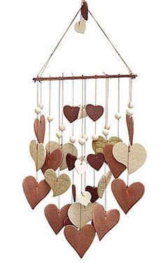 a wind chime with hearts hanging from it