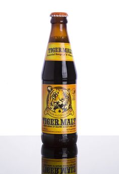 a bottle of tiger mate beer sitting on top of a table