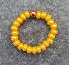 Yellow glass ring  Elastic and handmade by Turkoise Jewels Friendly prices from $4,99 to $9,99 ✅ Christmas gift idea 🎁🎄 💛 Comfortable stretch yellow ring featuring high quality seed beads circa 4 mm from Czech Republic, bringing you good sunny vibes all year long!  💛 Ring available for women and girls in 4 sizes: S - slim fingers (50 mm - 53 mm) M - standard size (54 mm - 57 mm) L - bigger fingers (58 mm - 61 mm) XL - big size (62 mm - 64 mm) All the comfortable adjustable rings from Turkois Slim Fingers, Big Finger, Elastic Rings, Sunny Vibes, Yellow Ring, Yellow Rings, Stretch Ring, Glass Ring, Minimalist Ring