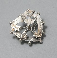 Sterling silver brooch, dating from the early 20th century. This piece has an UK hallmark for Chester 1915 but the makers mark is too worn to read. This brooch is approx. 2.3cm x 2.4cm. Condition: It has a little wear but generally in good vintage condition. Vintage Sterling Silver Brooches For Wedding, Vintage Sterling Silver Brooch For Wedding, Antique Heart Brooch For Wedding, Vintage Sterling Silver Wedding Brooches, Antique Heart-shaped Wedding Brooch, Antique Sterling Silver Brooches For Wedding, Antique Sterling Silver Wedding Brooches, Vintage Heart-shaped Wedding Brooches, Vintage Antique Silver Sterling Silver Brooches