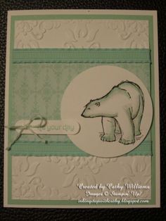 a close up of a card with a polar bear on the front and bottom corner