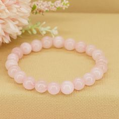 Wrap yourself in the gentle embrace of love and compassion with our Gemstone Rose Quartz Bracelet. Crafted from exquisite rose quartz beads, this bracelet serves as a reminder to open your heart, nurture your relationships, and cultivate inner peace and harmony. * High-Quality Beaded Bracelet* Unisex Bracelet* 8mm beads* Made to Fit Your Wrist or Anklet* Made with Pure Positive Energy* Great Gift for Everyone Pink Rose Quartz Bracelets For Meditation, Pink Rose Quartz Bracelet For Meditation, Rose Quartz Beaded Bracelet For Meditation, Elegant Rose Quartz Crystal Bracelet For Meditation, Rose Quartz Round Beads Bracelet For Valentine's Day, 8mm Rose Quartz Meditation Bracelets, Love And Compassion, Open Your Heart, 8mm Beads