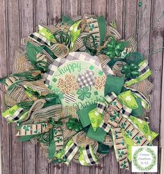 a st patrick's day wreath on a wooden fence