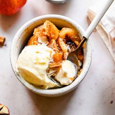 a bowl filled with ice cream and fruit