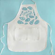 a white apron with blue writing on it