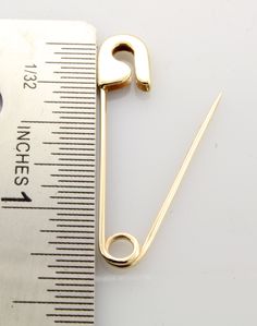 Yellow gold safety pin made of solid 14K gold 1.25'' long About 1.2 to 1.4 Grams Please note these pins are not mass produced or cast , each and every one is handmade in our shop with care and great attention to detail. We can personalize your pin by engraving your initial. The jewelry we make is made with recycled and re-refined environmentally responsible precious metals. 14K Solid Gold Pin's are made in USA and are of the highest quality. They are nicely polished and stamped for authenticity. Gold Safety Pin Lapel Pin Gift, Gold Safety Pin Lapel Pin For Gift, Gold Safety Pin Shaped Brooch, Gold Safety Pin Shaped Brooch Jewelry, Gold Safety Pin Lapel Brooch, Cursive Alphabet, Gold Pin, Boston Ma, Initial Letters