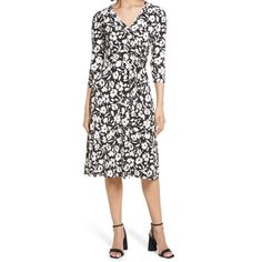 This Eliza J Dress Is A Stunning Addition To Any Wardrobe, With A Beautiful Floral Pattern And A Classic (Half) Wrap Design. The Dress Features A Surplice Neckline, Half Sleeves, And A Knee-Length Hemline, Making It Suitable For A Variety Of Occasions Including Travel, Parties, Workwear, And Casual Outings. The Pullover Closure And Basic Sleeve Type Add Convenience And Comfort, While The Belted Waistline Creates A Flattering Silhouette. The Dress Is Made From A Comfortable And Stretchy Polyester Elegant Black And White Midi Dress For Spring, Fitted Knee-length Black And White Midi Dress, Fitted Black And White Knee-length Midi Dress, Fitted Black And White Midi Dress, Black And White Midi Dress For Spring, Casual Fitted Black And White Midi Dress, Black And White Knee-length Midi Dress For Spring, Black And White Midi Length Dress, Black And White Dresses For Work