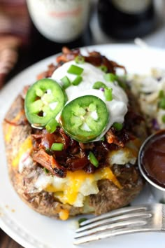 an open face sandwich with cheese and jalapenos on it