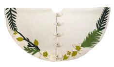 an embroidered white collar with green leaves and flowers