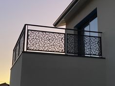 a building with a balcony that has an iron grill on the top and bottom part