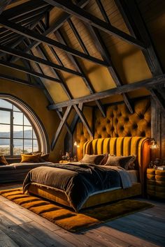 a bedroom with a large bed in the middle of it and lots of windows above