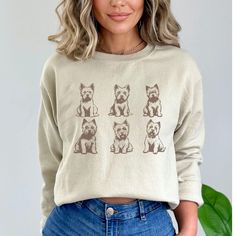 Stay cozy in our Vintage Style Westie Dog Sweatshirt--adorable design for dog enthusiasts, perfect for chilly days and cuddle sessions with your pup. IMPORTANT INFORMATION - DTG printing - 50% cotton, 50% polyester - Pre-shrunk - Wash and dry normally (on cool for best results) - Do not bleach - Tumble dry: low heat; - Do not dryclean * S I Z I N G * - Models are wearing size small (some photos tee is knotted to the side, but it is sent untied, regular length) - Sizing is unisex so runs like men Casual Crew Neck Sweatshirt With Dog Print, Fall Long Sleeve Tops With Dog Print, Casual Long Sleeve Dog Print Tops, Cute Dog Print Crew Neck Top, Cute Crew Neck Top With Dog Print, Casual Crew Neck Tops With Dog Print, Casual Long Sleeve T-shirt With Dog Print, Fall Crew Neck Top With Dog Print, Westie Dog