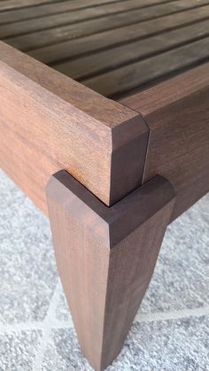 a close up of a wooden bed frame