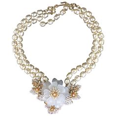 This stunning Camellia, pearl and crystal necklace has the characteristic features of Stanley Hagler's work but no oval stamp is present. Similar to the work of Stanley Hagler jewelry this piece is wired by hand, with stones and crystals prong-set into place rather than glued. Hagler’s ornate and opulent works combined contemporary designs with antique parts. He used the finest materials, and often incorporated hand-blown glass, Swarovski crystals and Russian gold plated filigree in his creations. Hagler specialized in faux pearl jewelry that use individually strung pearls to highlight their quality. Central flower dimensions: 3.25" wide x 2.25" high x 15.5" long. Provenance: Acquired from the Private Collection of Caroline, Countess de Cabarrus, London, United Kingdom Display Cupboard, Pearl Costume, Antique Costume Jewelry, Costume Necklace, Costume Jewelry Sets, Costume Necklaces, Vintage Display, Dragon Necklace, Contemporary Designs