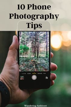 someone holding up their phone to take a photo in the woods with text overlay