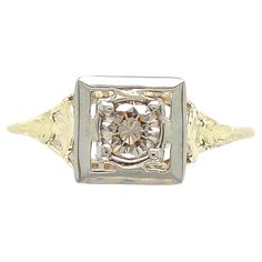 14K yellow gold filigree ring with a white gold top featuring a round brilliant cut diamond weighing .26cts. The diamond has SI clarity and champagne color. It measures about 4mm and has 4 new prongs. The ring fits a size 9.25 finger and weighs 1.31dwt. It dates from the 1940's. Heirloom 14k White Gold Diamond Ring In Gold, Gold Diamond Filigree Ring With Prong Setting, Yellow Gold Filigree Ring With Diamond And Prong Setting, Yellow Gold Filigree Ring With Round Cut, Art Deco Yellow Gold Filigree Ring With Diamond Cut, 14k Yellow Gold Filigree Ring With Diamond Accents, Classic Gold Filigree Ring With Diamond Accents, Classic Yellow Gold Filigree Ring With Single Cut Diamonds, Gold Filigree Ring With Single Cut Diamonds For Anniversary