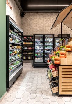 a grocery store filled with lots of fresh produce and veggies in the fridge