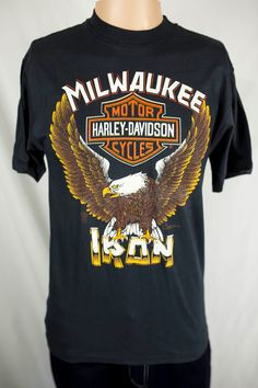 a black t - shirt with an eagle and the words milwaukee motor harley davidson cycles iron on it