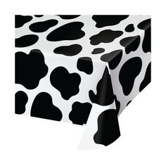 a black and white cow print tablecloth