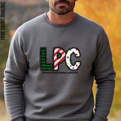 Stay cozy and festive with this licensed professional counselor Xmas sweatshirt. Perfect for those colder months, this medium-heavy fabric blend sweatshirt offers comfort and durability. A great gift for licensed professional counselors during the holiday season. Product features - Medium-heavy fabric blend for warmth - Embroidery decoration on left chest - Ethically grown US cotton - Classic fit with crew neckline for comfort - Double-needle stitching for durability Care instructions - Machine wash: cold (max 30C or 90F) - Non-chlorine: bleach as needed - Tumble dry: low heat - Do not iron - Do not dryclean Licensed Professional Counselor, Mental Health Counselor, Therapist Gifts, Embroidery Decoration, Stay Cozy, Christmas Sweater, Heavy Fabric, Crew Neckline, Christmas Sweaters