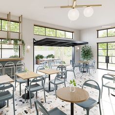 the interior of a restaurant with tables and chairs