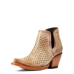 An edgy update to Ariat's best-selling bootie, this studded number turns any outfit into a head-turner. Use it to balance out floral tops or flouncy dressesor lean in with jeans and a band tee. ATS lightweight forked shank for enhanced support Full-grain leather Leather lining Easy slip-on style Single stitch welt Non-removable comfort insole Hand-nailed color stained veg-tan leather outsole Ariat Dixon, Lean In, Stud Design, Wedding Boots, Side Design, Western Boots Women, Studded Boots, Veg Tan Leather, Western Boot