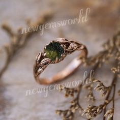 a close up of a ring with leaves on it and the words nevermoren world