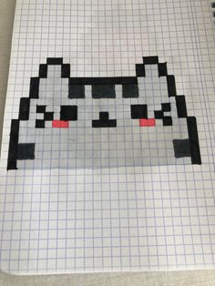 a piece of paper with an image of a cat in pixellated style on it