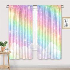 a window curtain with rainbow clouds and stars on it