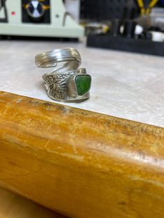 Hand made here on Maui spoon ring with a green sea glass set in a bezel. Ring right now is a size 7 but I could make it a little bigger without much trouble. Spoon is silver plate bezel is 925 silver. Sea glass was found here on Maui. I can also do custom orders. Green Sterling Silver Stackable Open Rings, Unique Green Toe Rings, Unique Adjustable Green Stackable Rings, Adjustable Silver Ring With Sea Glass, Unique Green Nickel-free Rings, Beachy Necklace, Sea Glass Ring, Silver Sea, Spoon Ring