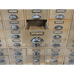 an old metal filing cabinet filled with lots of drawers