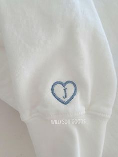 This is for adding on to the sleeve. Outline of a heart with the initial of your choice on the inside. Can be added on to sweatshirt or t shirts. White Sweatshirt With Letter Embroidery As Gift, Casual Sweatshirt With Embroidered Logo As Gift, White Embroidered Heart-shaped Top, White Embroidered Tops With Heart Design, Embroidered White Sweatshirt For Gift, Casual Top With Letter Embroidery As Gift, Heart-shaped Cotton Sweatshirt For Winter, Sleeve Outline, Sleeve Embroidery