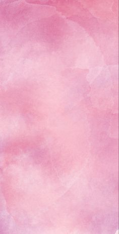 a pink and purple background with watercolor stains