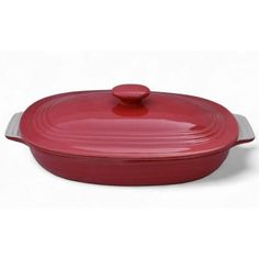 a red casserole dish with a lid on the side and a white background