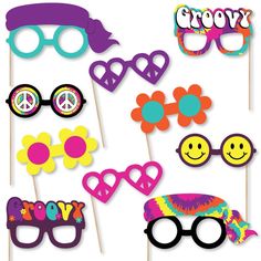 a group of party photo booth props with sunglasses and flowers on them, including the word grooby