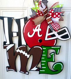 the front door is decorated with an apple and football theme