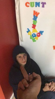 the photographer is flashing the middle finger at a teenager sitting on the floor, the fridge behind them says 'cunt' and an arrow to the teen in magnet letters Cursed Sibling Images, Cursed Pinterest Images, School Cursed Image, Cursed Imagine Redraw, Cursed Image People, Cursed Decorations, Cursed Group Images Funny, Cursed Photo Ideas, Cursed Funny Images Redraw