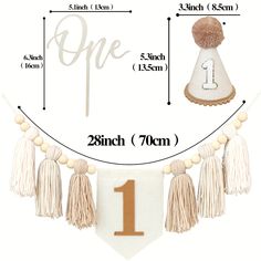 an image of a birthday banner with tassels on it and the number one