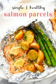 salmon, potatoes and asparagus wrapped in foil with text overlay that reads simple healthy salmon pares