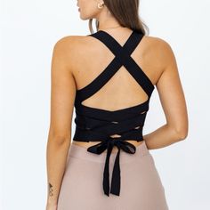 Soft Snd Sexy Crop Top With X Tie Back 80% Cotton 20% Nylon Fitted Black Crop Top With Tie Back, Chic Cross-tied Crop Top For Night Out, Fitted Black Crop Top With Strappy Back, Black Seamless Top With Strappy Back, Fitted Black Tops With Crisscross Straps, Black Tie Back Crop Top For Spring, Black Tie-back Crop Top For Spring, Black Nylon Crop Top, Black Nylon Crop Top For Spring